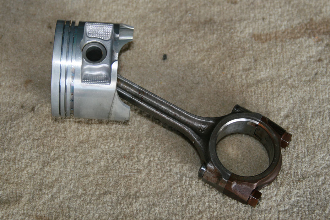 cleaning used pistons Grumpys Performance Garage